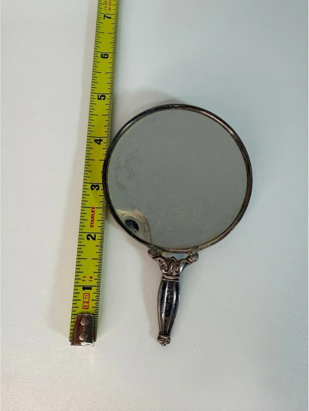 Vintage antique silver tone hand mirror with engraved sunburst back